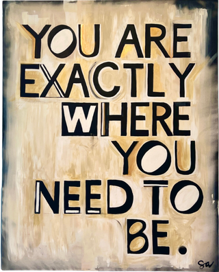 Black letters spelling, "You Are Exactly Where You Need To Be," on a tan background.